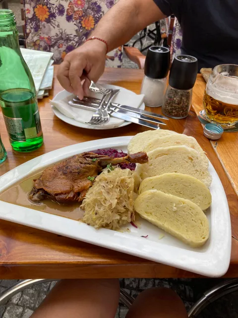 Roast poultry with cabbage and sliced Czech dumplings